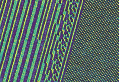 Magnetic Force Microscopy (MFM) scan of different magnetic domain patterns on a hard disc close to an intersector gap.